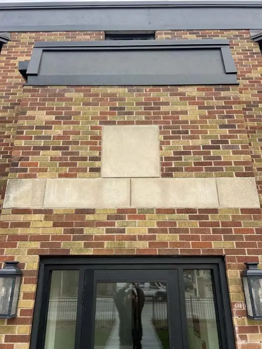 Tuck pointing on a commercial brick facade